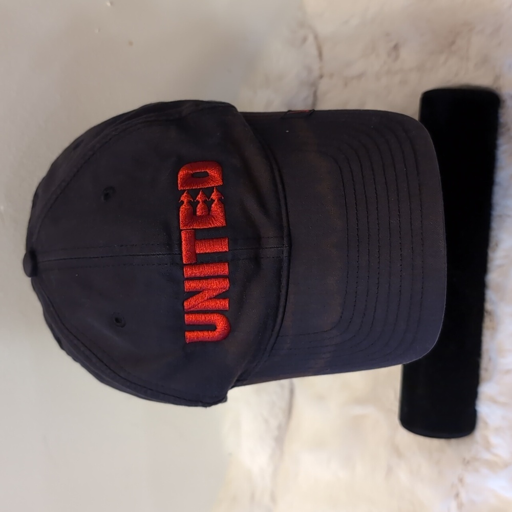 Nike| Black Manchester United Cap with Red Detailing and Crest Adjustable